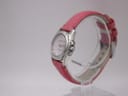 Right side profile of the Seiko Vivace quartz watch, showing the polished stainless steel case, crown, and pink strap.