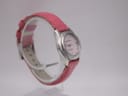 Left side profile of the Seiko Vivace quartz watch, highlighting the curved stainless steel case and pink leather strap.