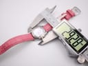 Seiko Vivace watch being measured by a digital caliper, displaying a precise case diameter of 28.28 mm.
