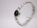 Side profile view of the small Seiko quartz watch, showing its silver-tone case and integrated bracelet.