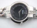 Detail of the stainless steel bracelet and signed Seiko folding clasp.