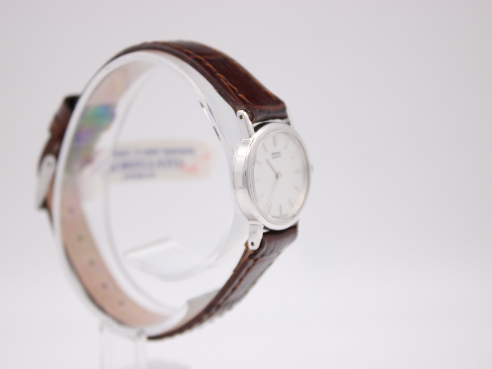 Close-up of the stainless steel case back with serial and model numbers.
