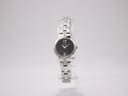 Front view of the Seiko 1N00-0SJ0 women's watch with black dial and crystal-accented bracelet on a stand.