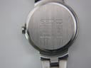 Close-up of the brushed stainless steel case back with Seiko branding and model/serial numbers.