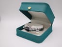 The Seiko watch displayed in a green presentation box.