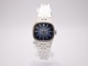 Front view of vintage Seiko 11-3940 ladies' watch with navy dial and silver-tone integrated steel bracelet.