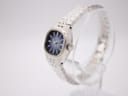 Angled side view of Seiko 11-3940 showing the textured silver-tone case and integrated bracelet.