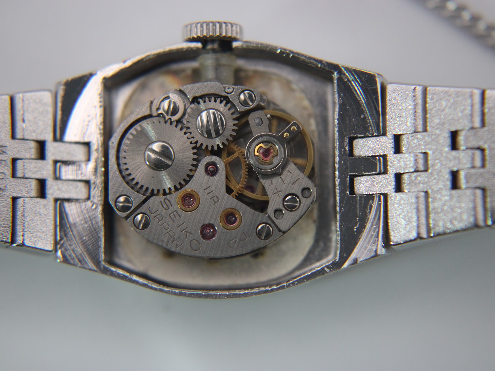 Macro shot revealing the hand-wind mechanical movement of the Seiko 11-3940 watch.
