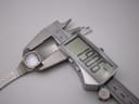 Digital caliper measuring the case size of the Seiko 11-3940, displaying 19.06mm.