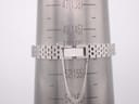 Close-up of the Seiko 11-3940's steel bracelet clasp on a wrist sizing cone, showing a wrist size of 150mm.