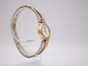 Another angled side view of the Seiko watch, showing the full circular shape of the bangle bracelet.