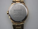Close-up of the stainless steel case back, showing Seiko branding, model number 1N00-0GN0, serial number, and 'water resistant' text.