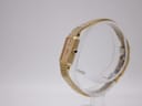 Side view of the Seiko Lassale watch, showing the elegant profile of the gold-tone case and the black cabochon crown.