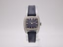 Front view of vintage Seiko 11-3490 watch with navy dial and square silver case.