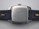 Detail shot of the navy blue dial with applied silver baton indices and Seiko logo.