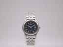 Front view of a Seiko 7N82-0340 quartz watch with navy blue dial and stainless steel bracelet.