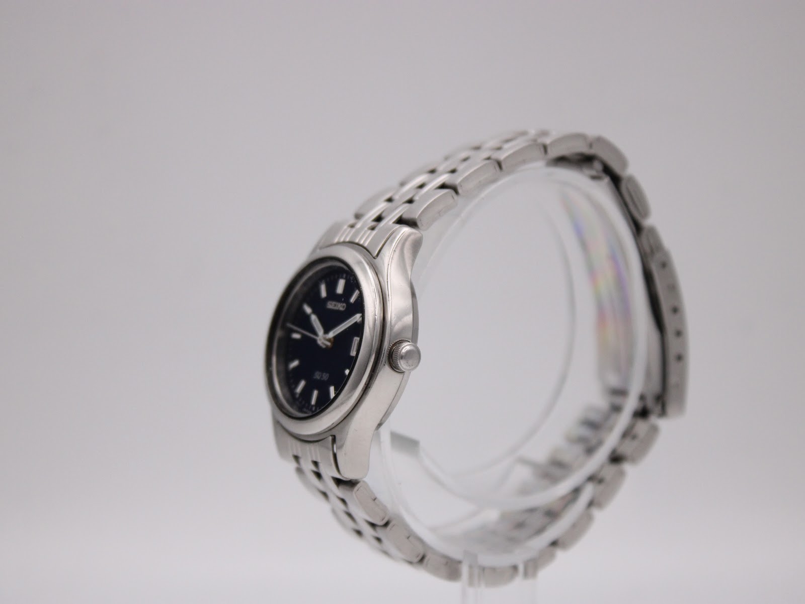 Side profile of the Seiko vintage watch, showcasing its slim case and steel multi-link bracelet.