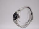 Side profile of the Seiko vintage watch, showcasing its slim case and steel multi-link bracelet.