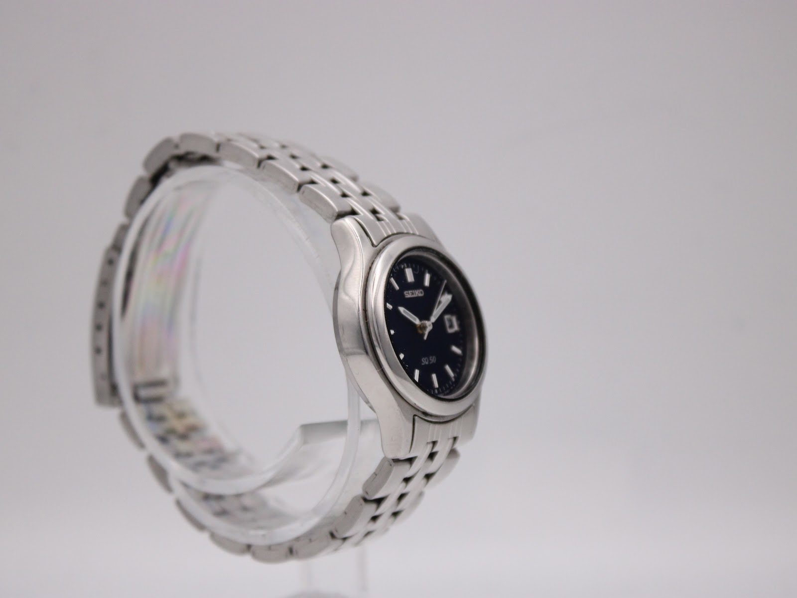 Close-up of the stainless steel bracelet clasp, showing the Seiko signature.