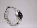 Close-up of the stainless steel bracelet clasp, showing the Seiko signature.