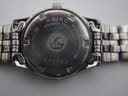Detailed view of the navy blue dial with applied baton indices and date window at 3 o'clock.