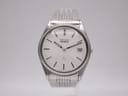 Front view of Seiko 8222-8020 quartz watch with silver-white dial, baton indices, and date window, on a stainless steel bracelet.