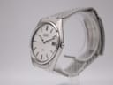Angled view of the Seiko 8222-8020 watch, showing the silver stainless steel case, crown, and integrated bracelet.
