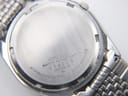 Close-up of the Seiko watch's stainless steel case back, showing "Seiko Water Resistant", serial number "214218", and model number "8222-8020".