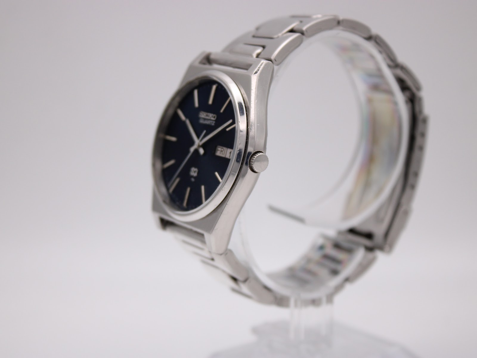 Side profile of the vintage Seiko watch showing the angular case shape and integrated bracelet.