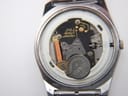 Rear view of the brushed stainless steel case back with model and serial numbers.