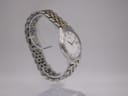 Close-up of the watch's two-tone stainless steel bracelet and signed Seiko butterfly clasp.