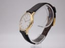 Side profile of the gold-plated Seiko dress watch, highlighting the slim case design.