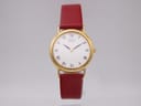 Front view of the Seiko V700-6K30 watch with a gold-tone case, white dial, black Roman numerals, and a burgundy leather strap.