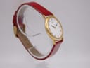 Another three-quarter side view of the Seiko watch, highlighting the minimalist design of the gold-tone case and the new-looking burgundy leather strap.