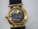 Close-up of the open case back revealing the Seiko quartz movement with 'Japan' text and copper coil.