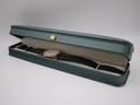 Angled view of the Seiko watch resting inside a green presentation box with a cream interior.