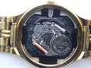 Close-up of the open case back revealing the Seiko V722A quartz movement with a Renata 371 battery.