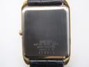 Detailed view of the white dial with Roman numerals and Seiko Quartz branding.