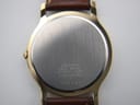 Detailed view of the dark brown leather strap, with its texture and stitching visible.