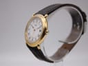 Angled side view of the Seiko watch, highlighting the elegant gold-tone case and profile of the strap.