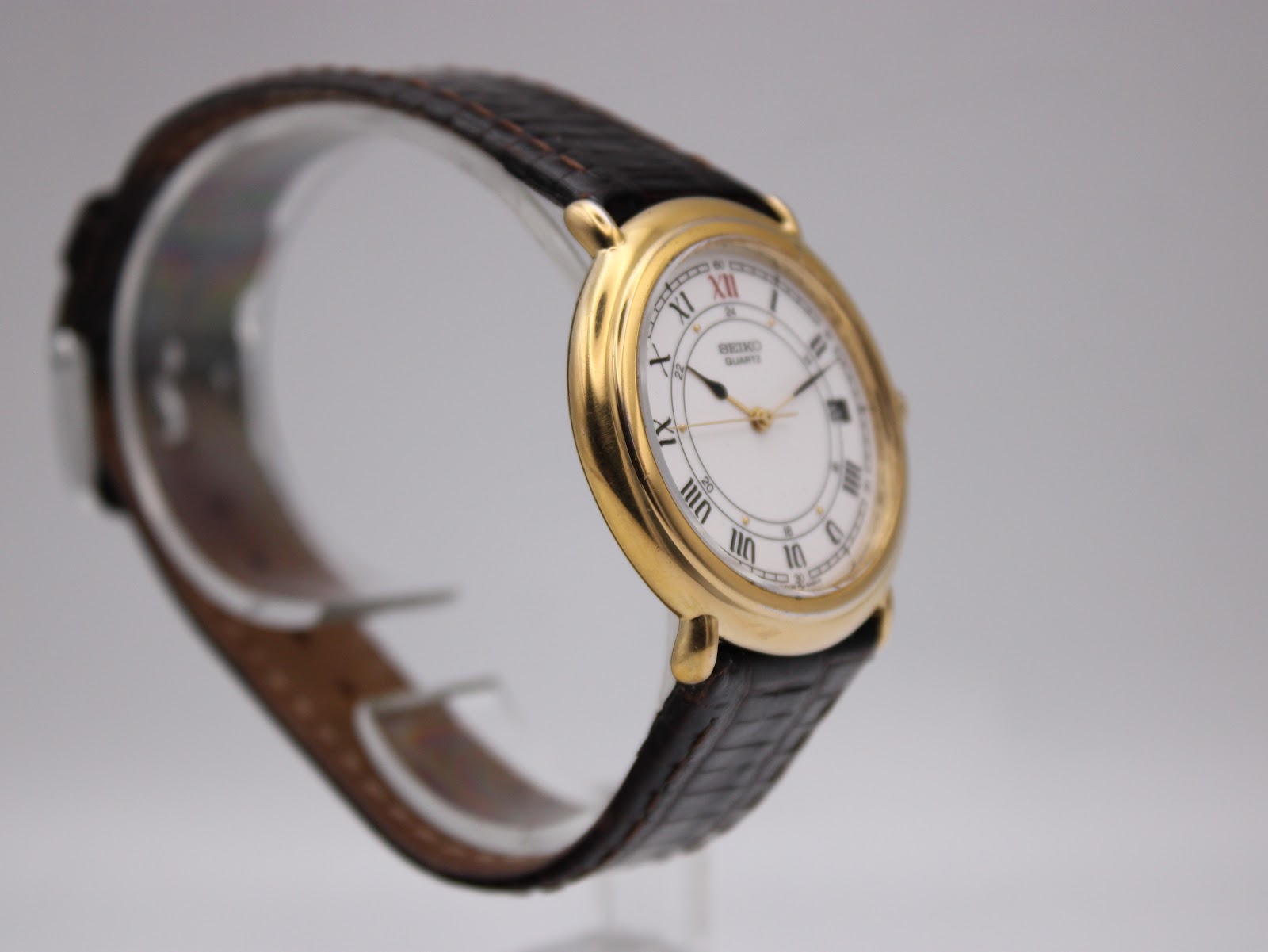 Another angled side view of the Seiko 5Y32-6A20, showing the watch on a display stand.