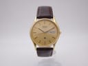 Front view of the Seiko 8223-7080 gold plated quartz watch with a gold dial and brown leather strap.
