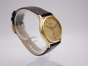Another angled side view of the Seiko watch, highlighting the watch's slim profile and case curvature.