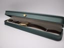 The Seiko watch displayed in a green, non-original presentation box with a crown emblem.