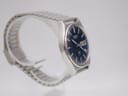 Another side angled view of the Seiko 7123-8430 watch, showing the brushed finish on the case and the bracelet's design.