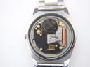 Interior view of the watch showing the Seiko 7123 quartz movement with a Renata 390 battery installed, revealing 'Two Jewels Japan' text.