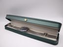 The Seiko 7123-8430 watch resting inside a generic dark green presentation box, suggesting a neat storage option.