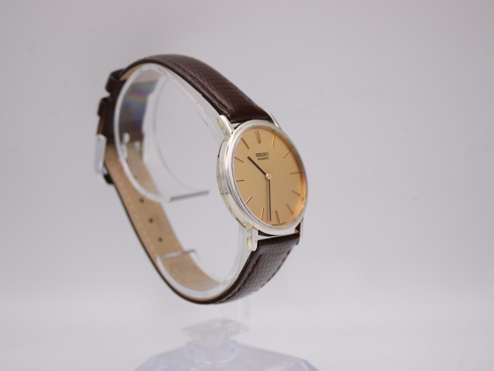 Another angled view of the Seiko 7800-7009 watch, highlighting the textured brown leather strap.
