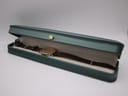 The Seiko 7800-7009 watch resting inside a generic long green presentation box.