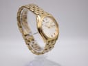 Another angled view of the gold-tone Seiko watch, highlighting the bracelet links and case wear.